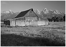 Historic Barn and Teton range, morning. Grand Teton National Park, Wyoming, USA. (black and white)