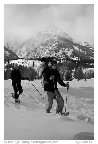 Couple snowshowing with baby. Grand Teton National Park (black and white)