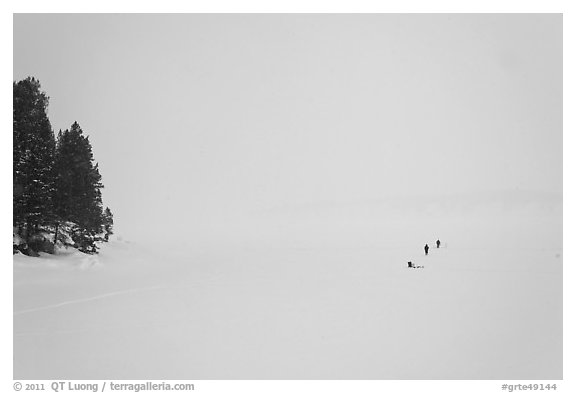 Frozen Jackson Lake in white-out, ice fishermen. Grand Teton National Park (black and white)