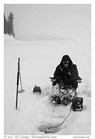 Ice fisherman with lounge chair and radar,Jackson Lake. Grand Teton National Park (black and white)
