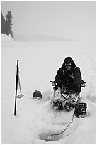 Ice fisherman with lounge chair and radar,Jackson Lake. Grand Teton National Park ( black and white)