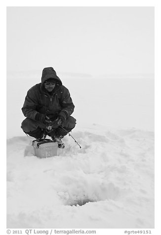 Ice fishing during a snow storm, Jackson Lake. Grand Teton National Park (black and white)