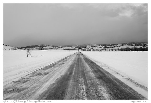 Road in winter at dusk, Gross Ventre valley. Grand Teton National Park (black and white)
