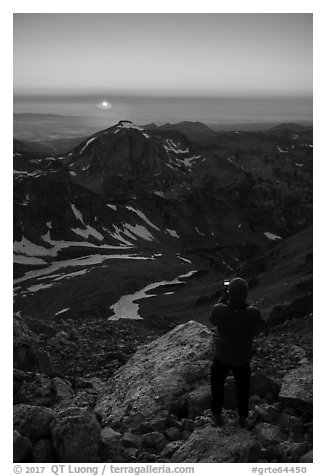 Mountaineer photographs sunset from Lower Saddle. Grand Teton National Park (black and white)