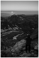 Mountaineer photographs sunset from Lower Saddle. Grand Teton National Park ( black and white)