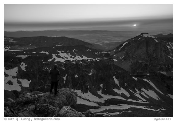 Mountaineer watches sunset from Lower Saddle. Grand Teton National Park (black and white)