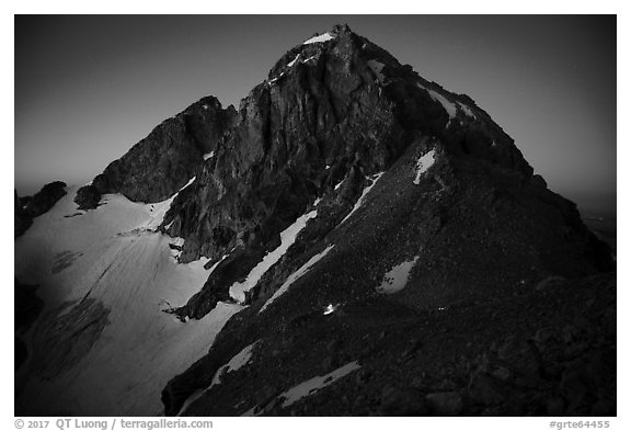 Middle Teton at night, with lights from climbers approaching. Grand Teton National Park (black and white)