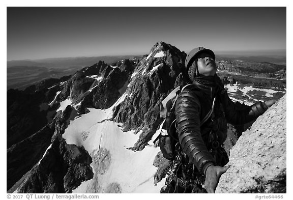 Mountaineer looks up while climbing Grand Teton. Grand Teton National Park (black and white)