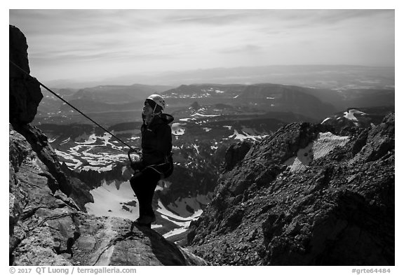 Woman climber rappels from Grand Teton. Grand Teton National Park (black and white)