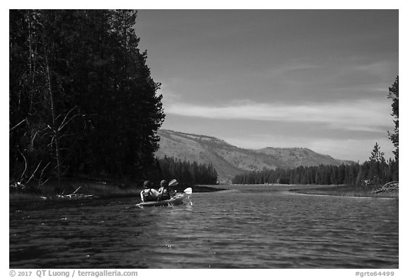 Kayakers approach narrow channel, Colter Bay. Grand Teton National Park (black and white)