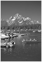 Boaters at Colter Bay marina with Mt Moran in the background, morning. Grand Teton National Park ( black and white)