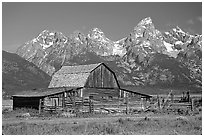 Historic Moulton Barn and Tetons mountain range, morning. Grand Teton National Park, Wyoming, USA. (black and white)