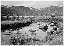 Creek, boulders, and meadow surrounded by mountains, autumn. Rocky Mountain National Park ( black and white)