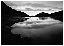 Pond with cloud reflexion at sunrise, Horsehoe Park. Rocky Mountain National Park ( black and white)