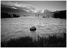 Rippled water in Sprague Lake, and snowy mountain range. Rocky Mountain National Park ( black and white)