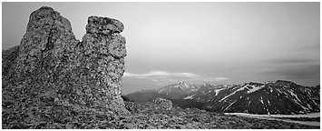 Rock towers on high pass and mountains at dusk. Rocky Mountain National Park (Panoramic black and white)