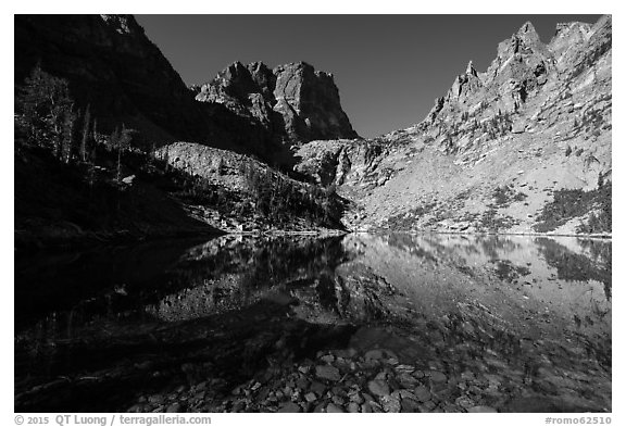 Granite walls climb straight out of Emerald Lake. Rocky Mountain National Park (black and white)