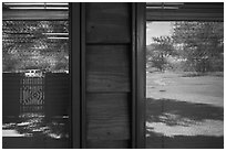 Meadow and parking lot, Medora Visitor Center window reflexion. Theodore Roosevelt National Park ( black and white)
