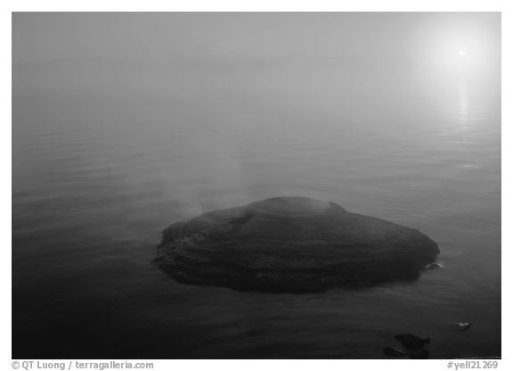 Fishing cone, fog, and  sun rising. Yellowstone National Park (black and white)