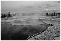 West Thumb Geyser Basin covered by snow at dusk. Yellowstone National Park, Wyoming, USA. (black and white)