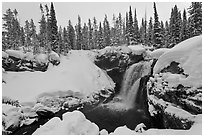 Snowy landscape with waterfall. Yellowstone National Park ( black and white)