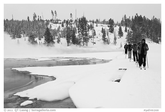 Cross country skiers pass Chromatic Spring. Yellowstone National Park (black and white)