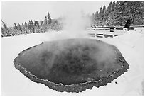 Hiker at Morning Glory Pool, winter. Yellowstone National Park ( black and white)