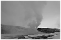Old Faithful Geyser at dawn. Yellowstone National Park ( black and white)