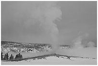 Old Faithful geyser plume in winter. Yellowstone National Park, Wyoming, USA. (black and white)