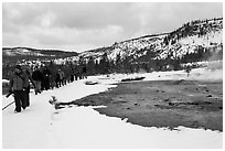 Large group of tourists in winter. Yellowstone National Park, Wyoming, USA. (black and white)