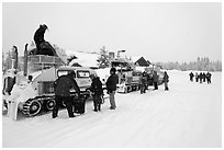 Bombardier snow busses being unloaded at Flagg Ranch. Yellowstone National Park, Wyoming, USA. (black and white)