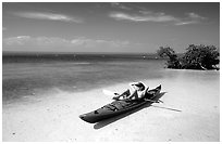 Kayaker relaxing on Elliott Key. Biscayne National Park, Florida, USA. (black and white)