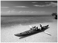 Woman reclining in kayak on shallow waters,  Elliott Key. Biscayne National Park ( black and white)
