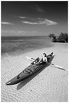 Woman sunning herself on sea kayak parked on shore,  Elliott Key. Biscayne National Park ( black and white)
