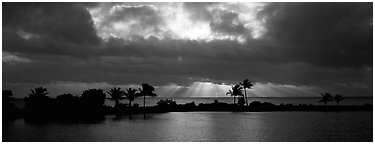 Sunrise with dark clouds over coastal lagoon. Biscayne National Park (Panoramic black and white)