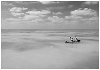 Sea kayakers in turquoise waters. Dry Tortugas National Park, Florida, USA. (black and white)