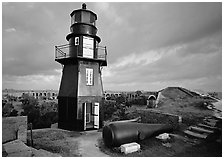 Lighthouse and cannon on upper level of Fort Jefferson. Dry Tortugas National Park, Florida, USA. (black and white)