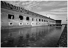 Fort Jefferson moat, walls and lighthouse. Dry Tortugas National Park, Florida, USA. (black and white)