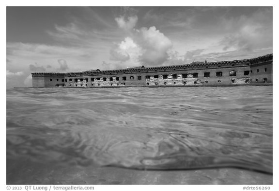 Split view of Fort Jefferson and water with fish. Dry Tortugas National Park (black and white)