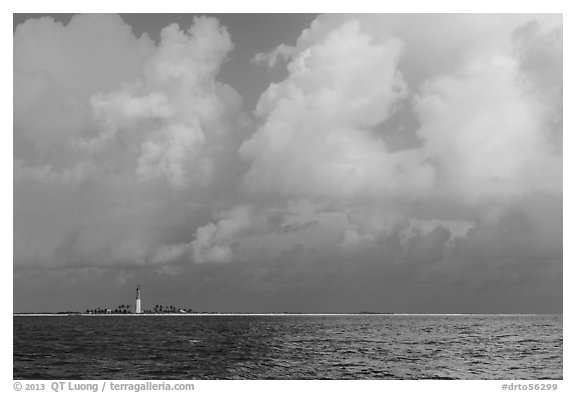 Loggerhead key and lighthouse under tropical clouds. Dry Tortugas National Park (black and white)