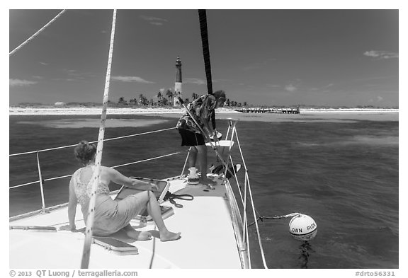 Sailors hooking mooring buoy at Loggerhead Key. Dry Tortugas National Park (black and white)