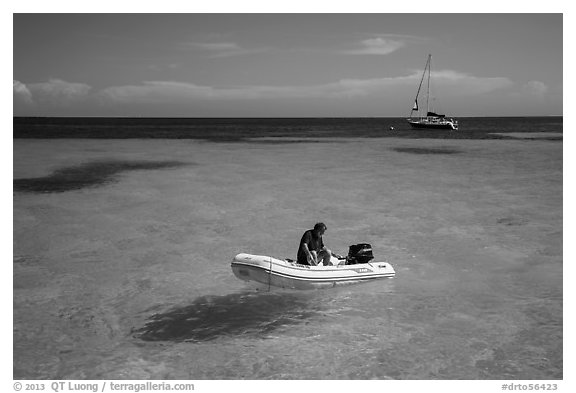 Dinghy and sailbaot in transparent waters, Loggerhead Key. Dry Tortugas National Park (black and white)