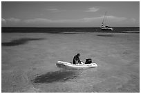 Dinghy and sailbaot in transparent waters, Loggerhead Key. Dry Tortugas National Park ( black and white)