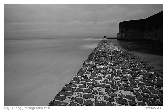 Brick seawall at dusk during a storm. Dry Tortugas National Park (black and white)