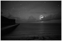 Fort Jefferson and beach at night with cloud electric storm. Dry Tortugas National Park, Florida, USA. (black and white)