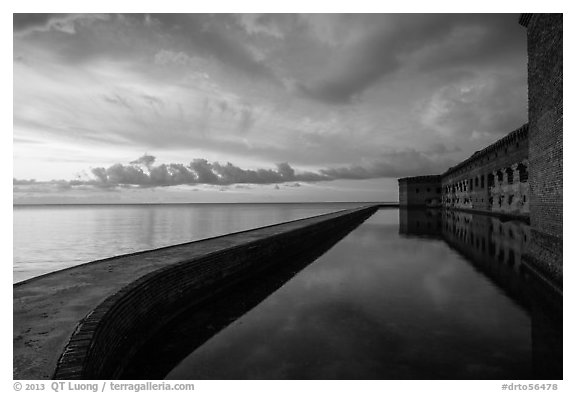 Fort Jefferson seawall, moat and walls at sunset. Dry Tortugas National Park (black and white)