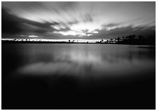 Dusk at Pine Glades Lake, with blured water and clouds. Everglades National Park, Florida, USA. (black and white)