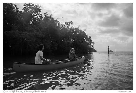Couple canoeing towards Florida Bay. Everglades National Park (black and white)