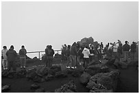 Tourists waiting for sunrise. Haleakala National Park, Hawaii, USA. (black and white)