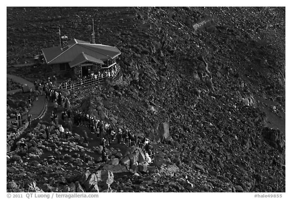 Visitor center and sunrise watchers at dawn. Haleakala National Park (black and white)